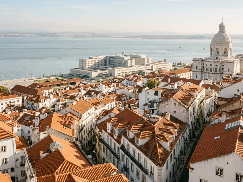 A modern hospital building in Lisbon by the Tagus river and terracotta rooftops